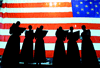 Members of a church choir prepare backstage with the American flag as a backdrop during "A Prayer for America" memorial in Miami, September 18.